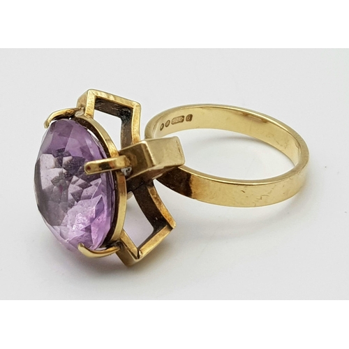 241 - A Vintage 9K Yellow Gold Amethyst Ring. 10ct round cut amethyst set in a raised foundation. Size K. ... 