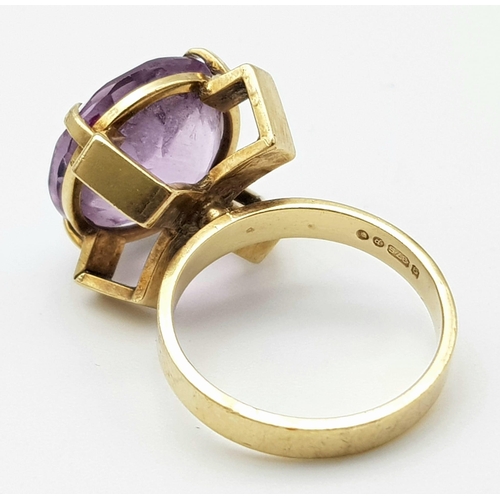 241 - A Vintage 9K Yellow Gold Amethyst Ring. 10ct round cut amethyst set in a raised foundation. Size K. ... 