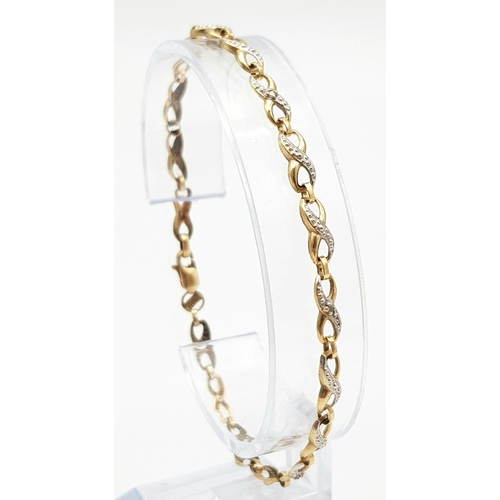 302 - A Vintage 9K Yellow Gold and Diamond Spacer Crossover Link Bracelet. 18cm length. 2.37g total weight... 