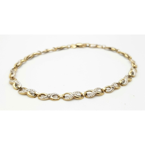 302 - A Vintage 9K Yellow Gold and Diamond Spacer Crossover Link Bracelet. 18cm length. 2.37g total weight... 