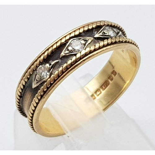 36 - A Vintage 9K Yellow Gold and Diamond Ring. Rope borders with three round cut diamonds. Size O. 2.97g... 