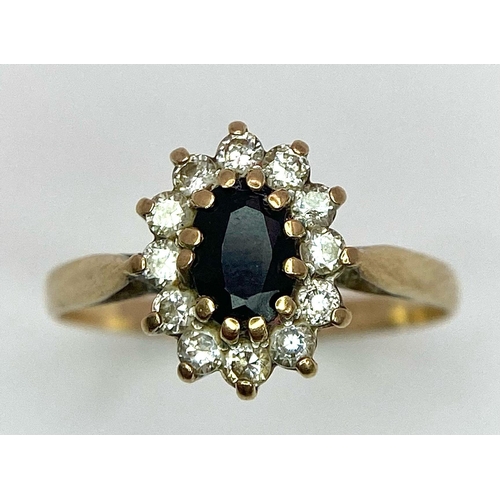 400 - A Vintage 9K Yellow Gold Diamond and Sapphire Ring. Central sapphire with a diamond halo. Size N. 1.... 