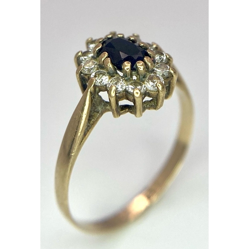 400 - A Vintage 9K Yellow Gold Diamond and Sapphire Ring. Central sapphire with a diamond halo. Size N. 1.... 