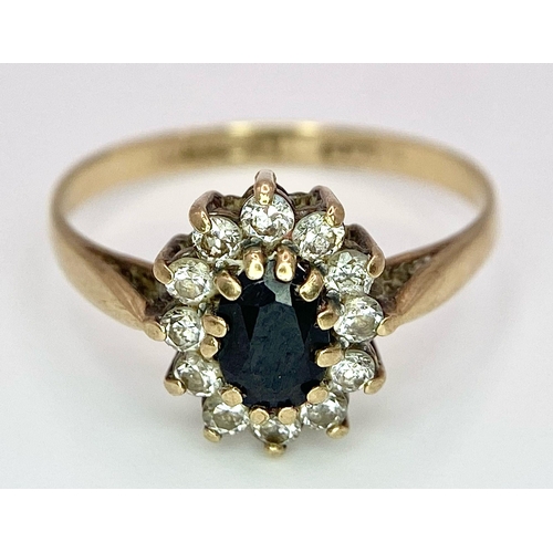 400 - A Vintage 9K Yellow Gold Diamond and Sapphire Ring. Central sapphire with a diamond halo. Size N. 1.... 