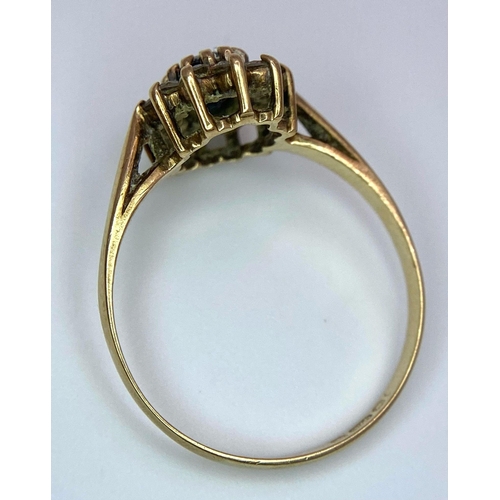 400 - A Vintage 9K Yellow Gold Diamond and Sapphire Ring. Central sapphire with a diamond halo. Size N. 1.... 