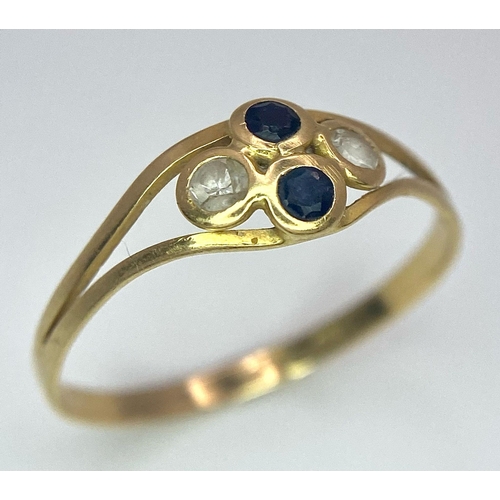 611 - An 18K Yellow Gold, Sapphire and White Stone Ring. Size Q. 1.23g total weight.