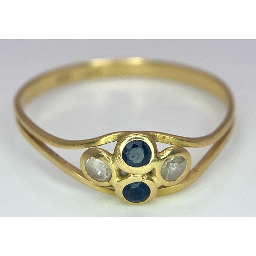 611 - An 18K Yellow Gold, Sapphire and White Stone Ring. Size Q. 1.23g total weight.