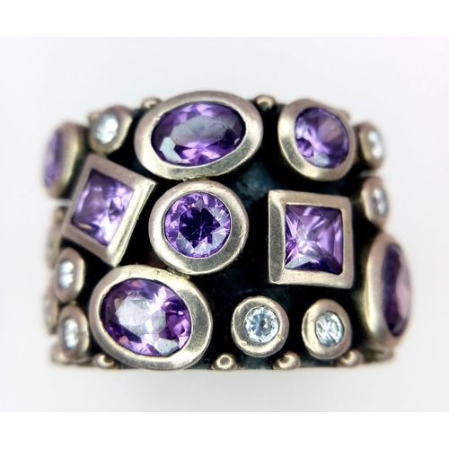 949 - A vintage 925 silver Amethyst and Zirconia stone set Gentlemen ring. Total weight 16.3G. Size R.