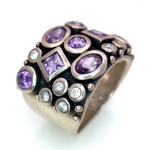 949 - A vintage 925 silver Amethyst and Zirconia stone set Gentlemen ring. Total weight 16.3G. Size R.