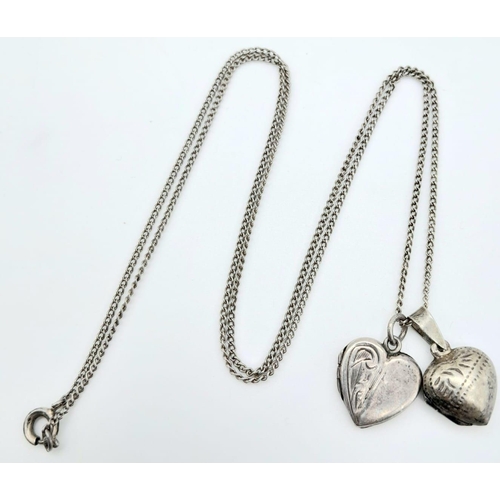 1012 - A vintage sterling silver necklace with 2 silver heart locket pendants. Total weight 5.6G. Total len... 