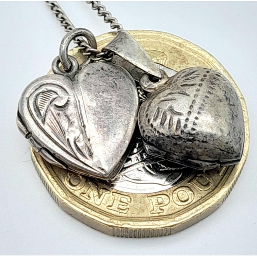 1012 - A vintage sterling silver necklace with 2 silver heart locket pendants. Total weight 5.6G. Total len... 