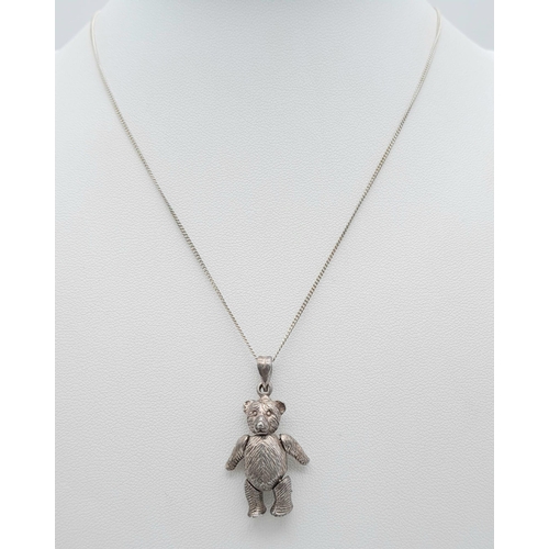 1096 - A vintage 925 silver articulated bear pendant on silver chain. Total weight 9.8G. Total length 45cm.