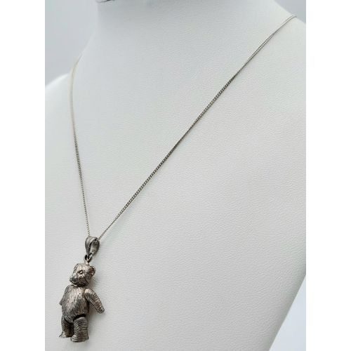 1096 - A vintage 925 silver articulated bear pendant on silver chain. Total weight 9.8G. Total length 45cm.