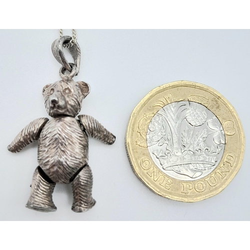 1096 - A vintage 925 silver articulated bear pendant on silver chain. Total weight 9.8G. Total length 45cm.