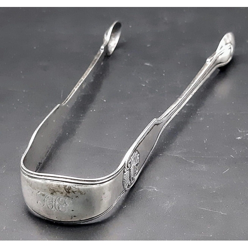 1145 - An antique Georgian sterling silver sugar tongs. Full hallmarks London, 1824. Total weight 52.6G. To... 