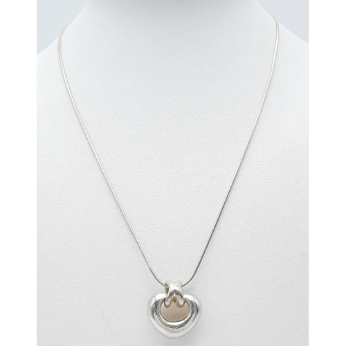 1329 - A stylist 925 silver abstractive heart pendant on silver chain. Total weight 8.75G. Total length 43c... 