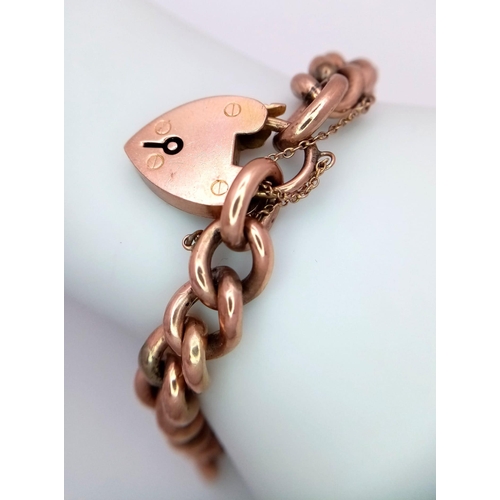 173 - A Vintage 9K Rose Gold Curb Link Bracelet with Heart Clasp. 
18cm. 17.21g weight.