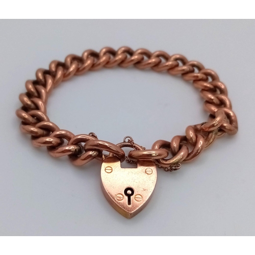 173 - A Vintage 9K Rose Gold Curb Link Bracelet with Heart Clasp. 
18cm. 17.21g weight.