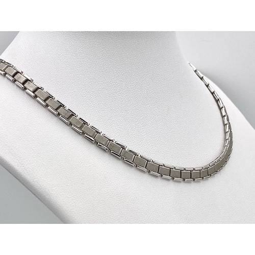 394 - A 14K White Gold Geometric Link Flat Choker Necklace. 20cm length. 14.1g weight.