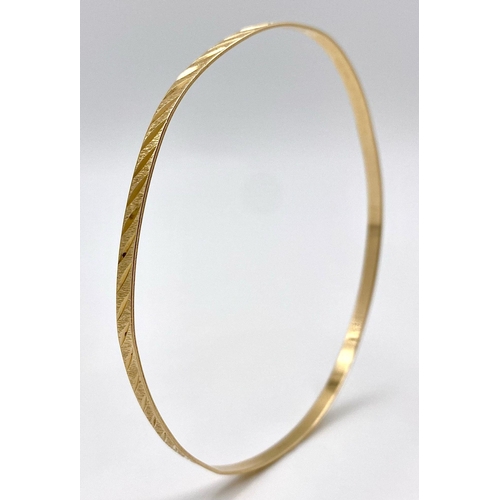 464 - A Vintage 9K Yellow Gold Bangle. 3.75g weight. 6.5cm inner diameter.