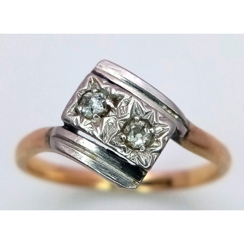 526 - A Vintage 9K Yellow Gold Crossover Diamond Ring. Size N. 3g total weight.