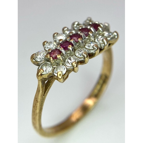 58 - A Vintage 9K Yellow Gold Ruby and Diamond Ring. Five rubies with a twelve diamond surround. Size J. ... 