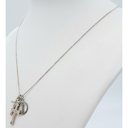 1082 - A 925 silver necklace with 2 cross and initial L pendants. Total weight 2.65G. Total length 54cm.