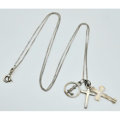 1082 - A 925 silver necklace with 2 cross and initial L pendants. Total weight 2.65G. Total length 54cm.