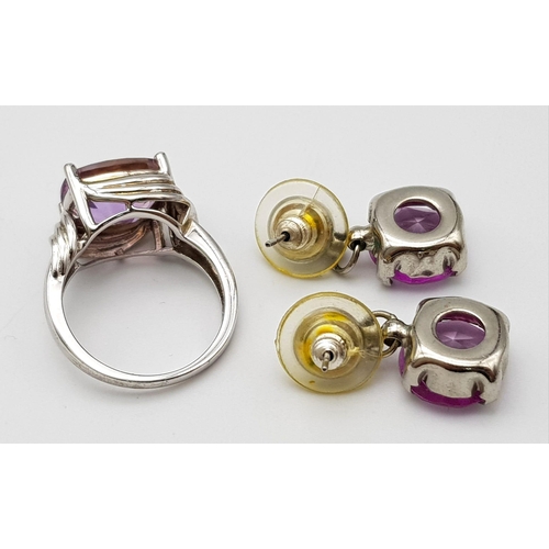 1166 - A matching set of Purple stone jewellery include a pair of drop earrings and a solitaire ring.