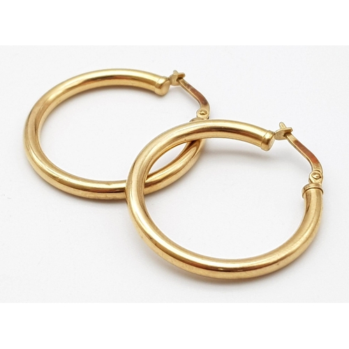 1257 - A Pair of Vintage 9K Yellow Gold Hoop Earrings. 25mm diameter. 2.36g total weight.