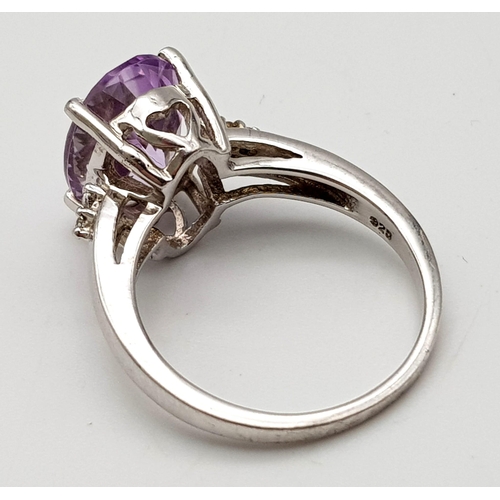 1312 - Large faceted amethyst silver cocktail ring, weight 5.2g size R, marked TGGC