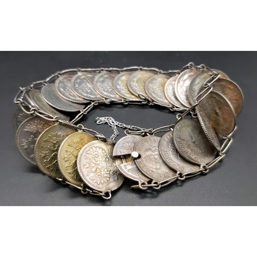 1386 - A vintage 24 coin set link bracelet. Total weight 25.7G.  Total length 23cm. Please see photos for d... 