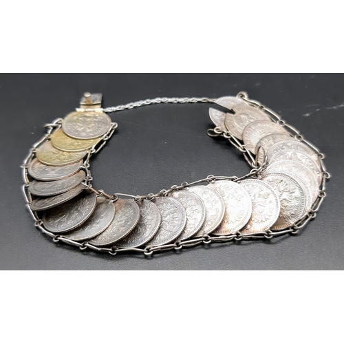 1386 - A vintage 24 coin set link bracelet. Total weight 25.7G.  Total length 23cm. Please see photos for d... 