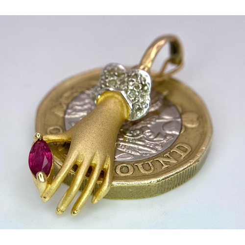 430 - A 14K Yellow Gold, Diamond and Ruby Hand Pendant. A diamond wristed feminine hand gently caresses a ... 