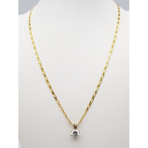 633 - A 9K Yellow Gold Flat Oval Link Necklace with a Bright White CZ Pendant. 44cm necklace length. 4.1g ... 