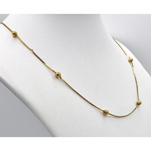 72 - A 14K Yellow Gold Necklace with Ball Decoration. 40cm. 2g weight.