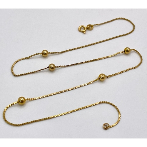 72 - A 14K Yellow Gold Necklace with Ball Decoration. 40cm. 2g weight.