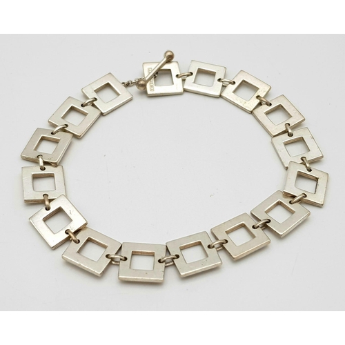 879 - A stylist Old Florence Italian sterling silver T-bar square link bracelet. Total weight 16G. Total l... 