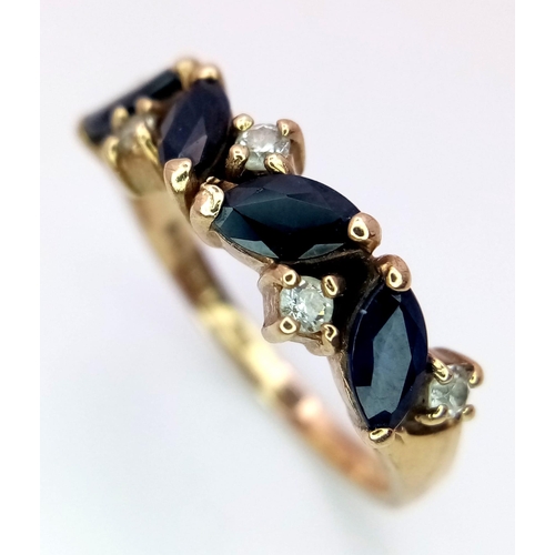 911 - A Vintage 9K Yellow Gold Sapphire and White Stone Ring. Size O. 3.2g total weight.