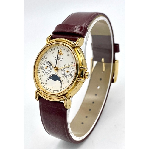 1472 - A Citizen Quartz Moonphase Unisex Watch. Burgundy leather strap. Gilded case - 33mm. In working orde... 