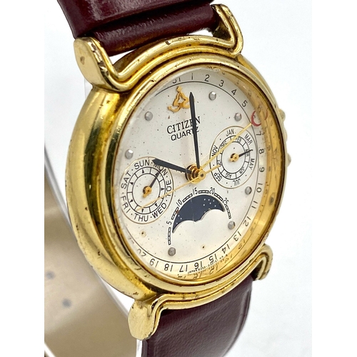 1472 - A Citizen Quartz Moonphase Unisex Watch. Burgundy leather strap. Gilded case - 33mm. In working orde... 