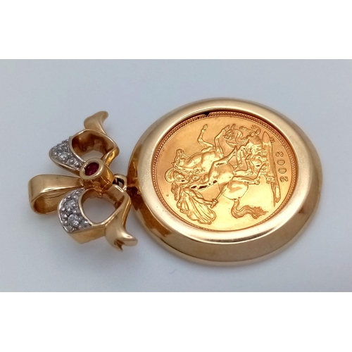 337 - A 22K Gold 2003 Half Sovereign in a Ruby and Diamond Pendant Setting. 4cm. 9.73g total weight.