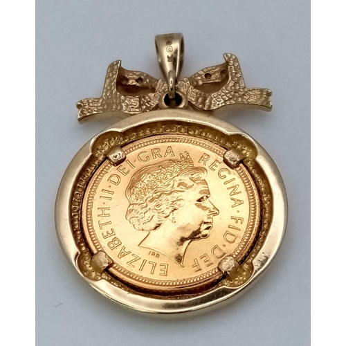 337 - A 22K Gold 2003 Half Sovereign in a Ruby and Diamond Pendant Setting. 4cm. 9.73g total weight.