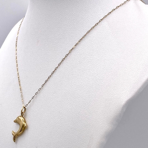 415 - A 9K Yellow Gold Dolphin Pendant on a 9K Yellow Gold Disappearing Necklace. 3cm and 46cm. 1g total w... 