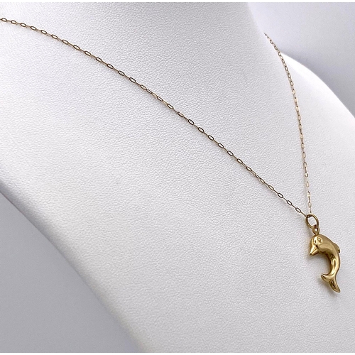 415 - A 9K Yellow Gold Dolphin Pendant on a 9K Yellow Gold Disappearing Necklace. 3cm and 46cm. 1g total w... 