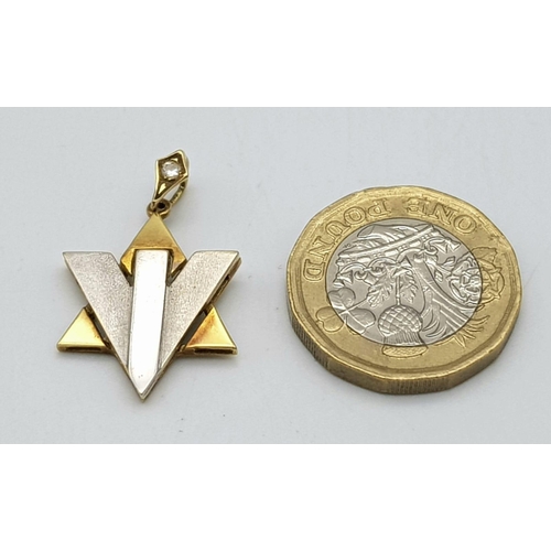 563 - A Futuristic 9K White and Yellow Gold Star of David Pendant. 
Single diamond decoration. 3cm. 3.8g w... 