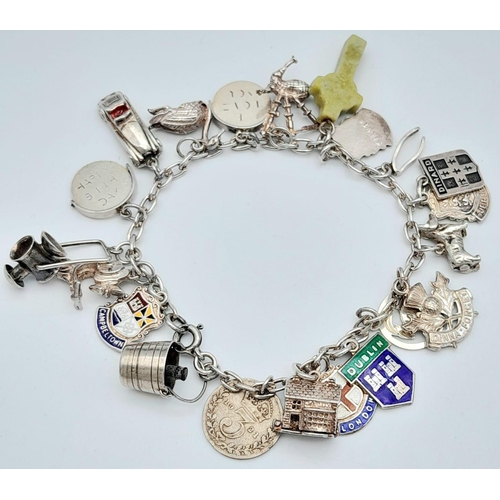 1026 - A vintage sterling silver multiple charm bracelet. Total weight 36.3G. Please see photos for more de... 