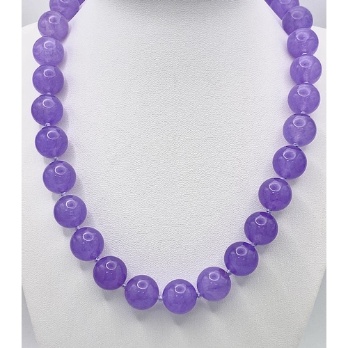 395 - A Vibrant Large Lavender Jade Bead Necklace. 14mm beads. 42cm necklace length.