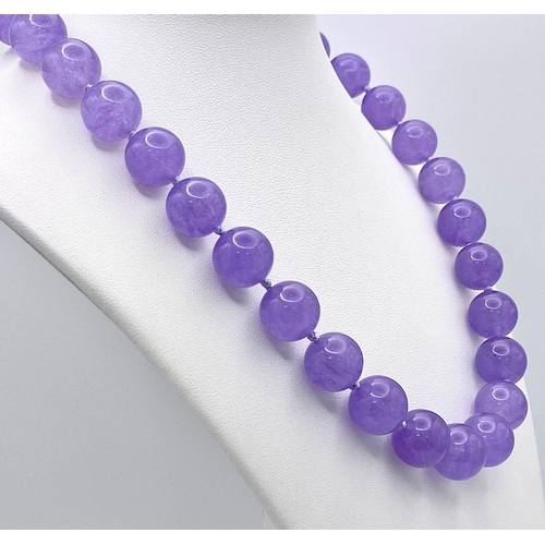 395 - A Vibrant Large Lavender Jade Bead Necklace. 14mm beads. 42cm necklace length.