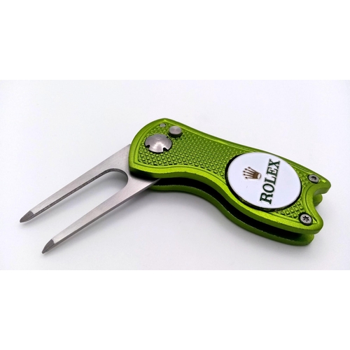 472 - A Rolex Branded 'Flick' Putting Divot Repair Tool. Removable magnetic ball marker. As new. 7cm